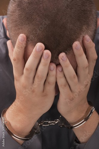 Arrested in handcuffs photo