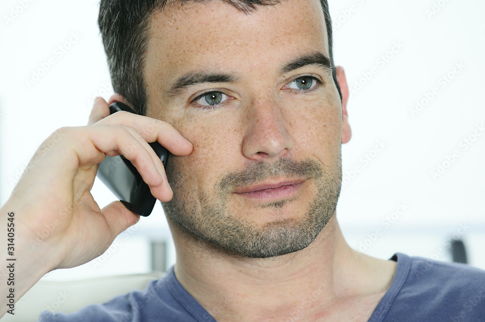 relaxed man is having a communication with a cellephone relaxed man is having a communication with a cellephone