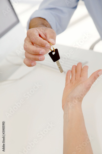 Wallpaper Mural Closeup on hands giving car key Torontodigital.ca