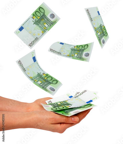 Female's hand and falling euros isolated on white background