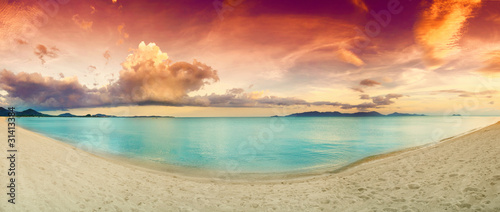 Panorama of tropical beach before sunset.
