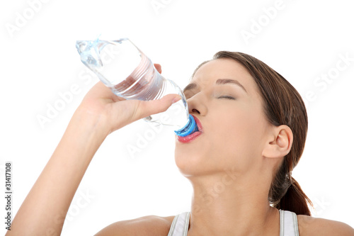 Beautiful woman with bottle of mineral water