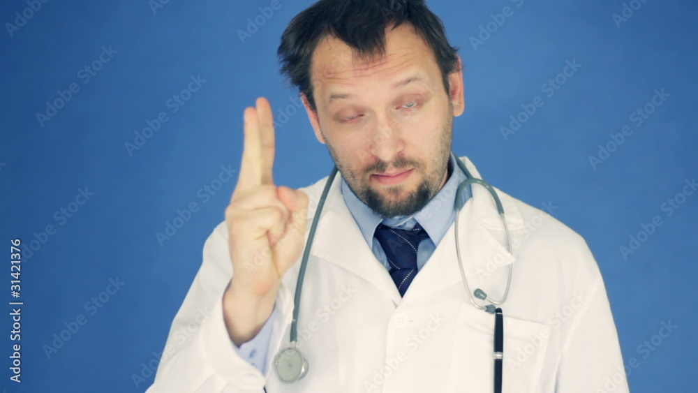 Male doctor talking to camera, giving advice on blue background Male doctor talking to camera, giving advice on blue background