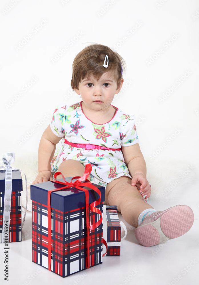 little girl sits with three gift boxes.isolated, little girl sits with three gift boxes.isolated,