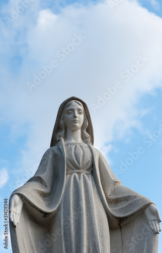 Monument Lady of Guadalupe on a cemetery