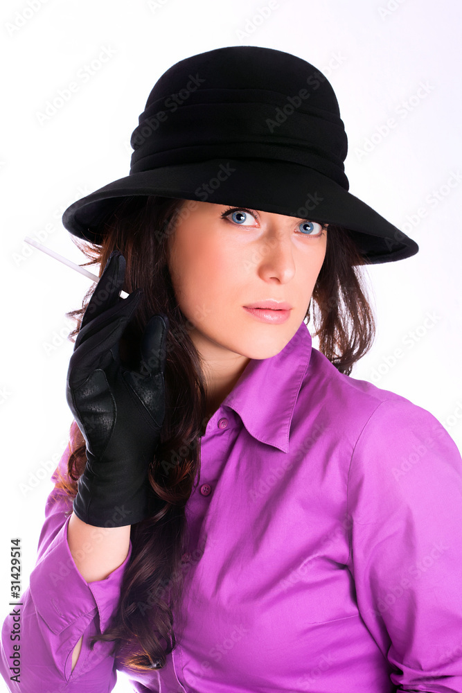 Portrait of a beautiful brunette young woman with cigarette Portrait of a beautiful brunette young woman with cigarette