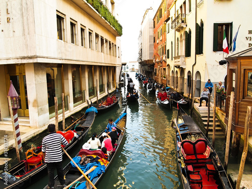 Traditional boats at narrow streets , Venice Italy