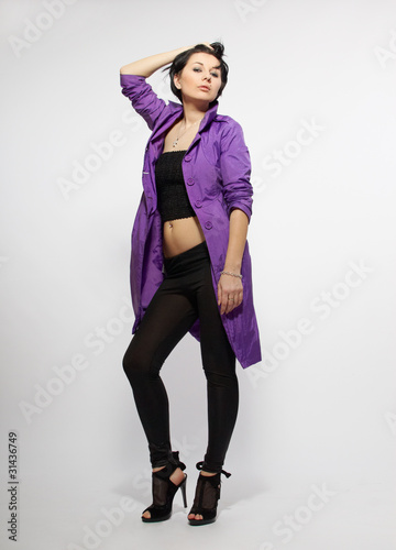 Pretty woman wearing purple coat