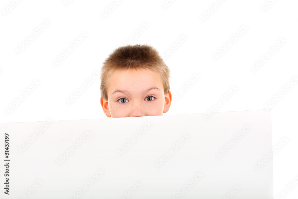 amazed boy face close-up behind the blank paper amazed boy face close-up behind the blank paper