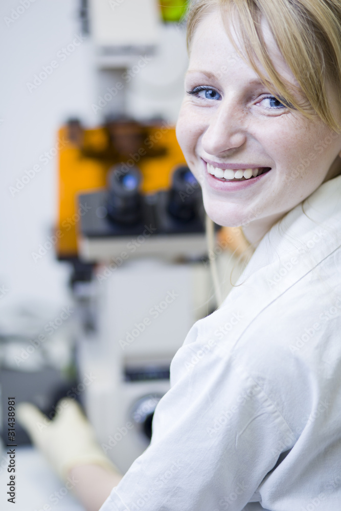 female researcher working in a lab female researcher working in a lab