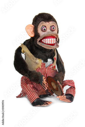 Fototapeta Damaged mechanical chimp with ripped vest, uneven eyes