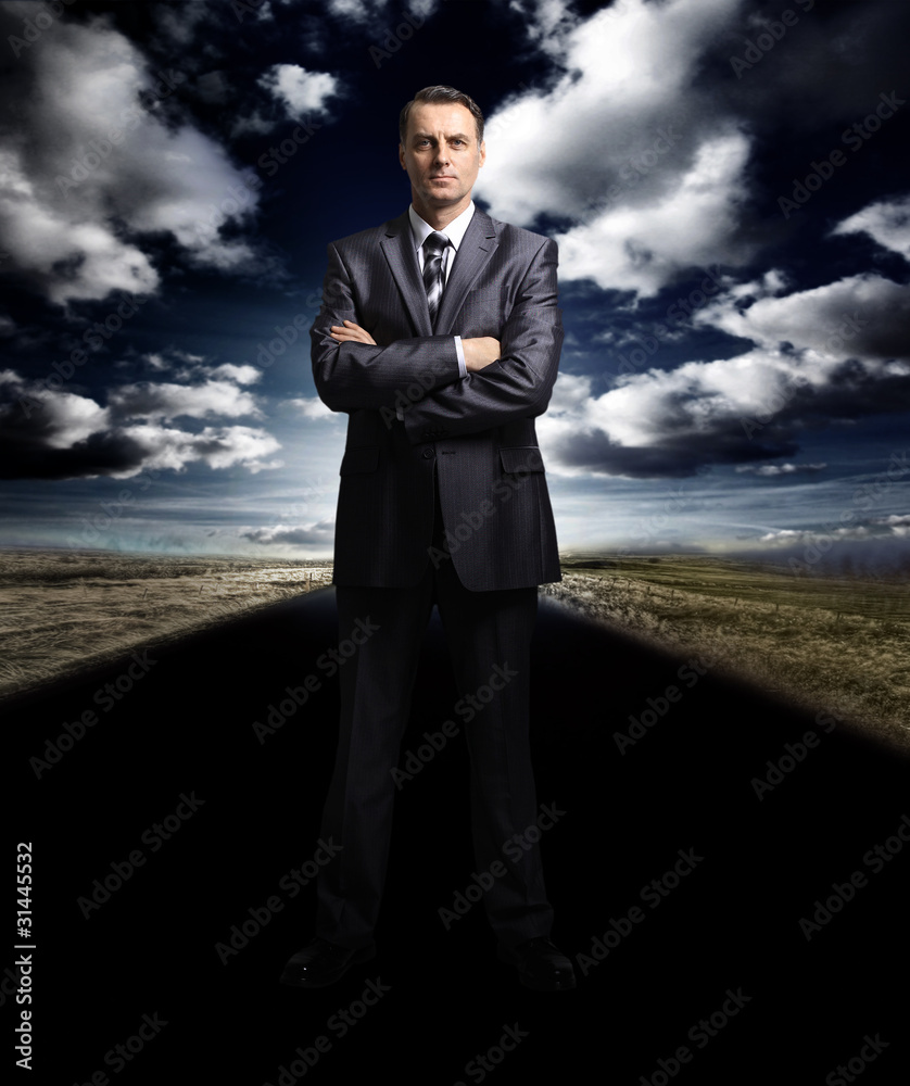 business man standing on the road business man standing on the road