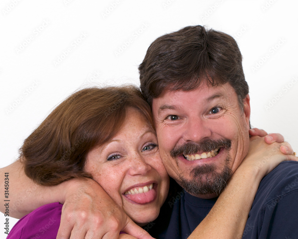 Man and wife enthusiastically hugging each other in love Man and wife enthusiastically hugging each other in love