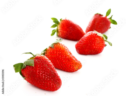 Few strawberries isolated on white