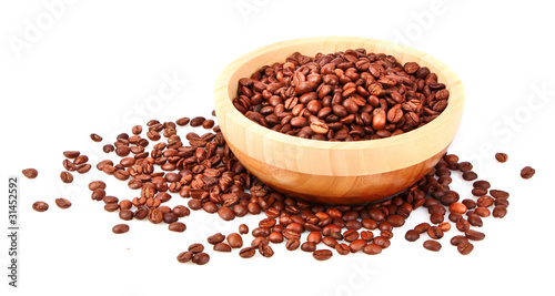 Plate with coffee beans isolated on white