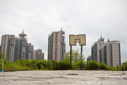 basketball court soon to be invaded by real estate development