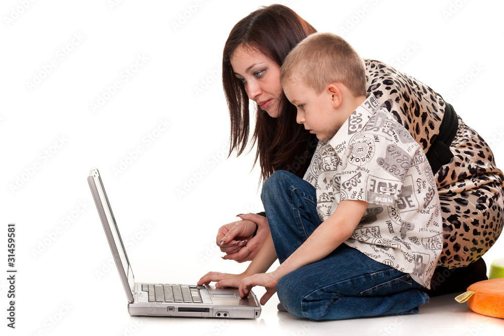 Mother and son playing with laptop