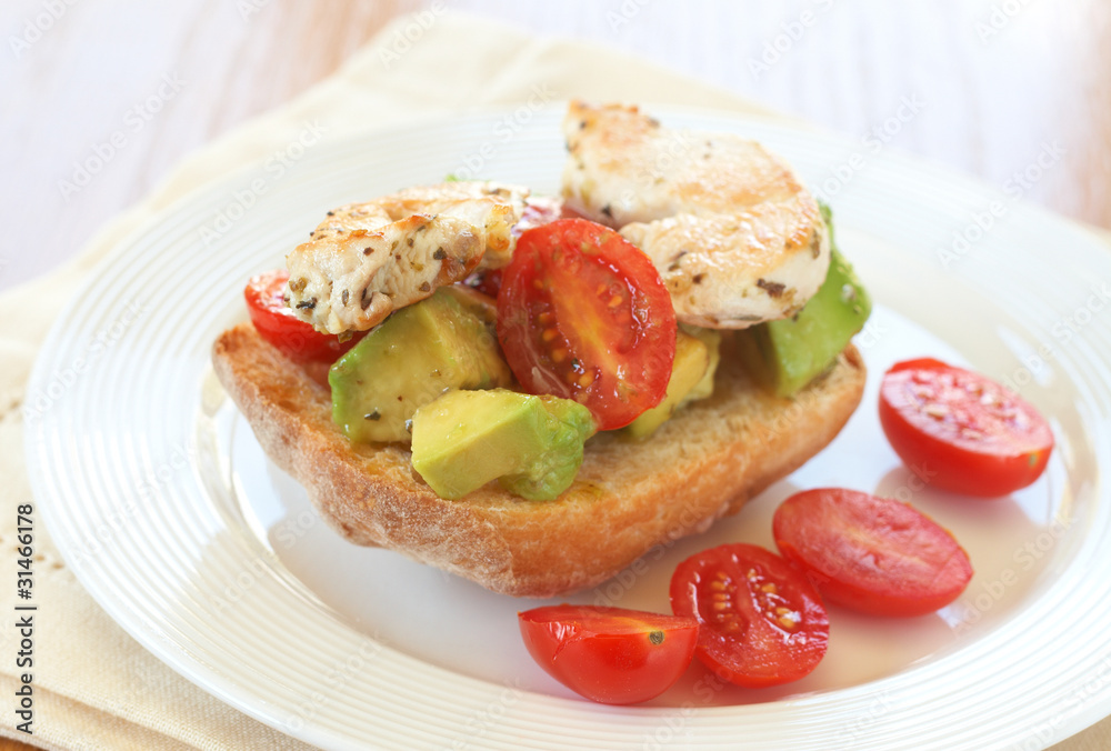 Tasty avocado, tomato and chicken bruschetta