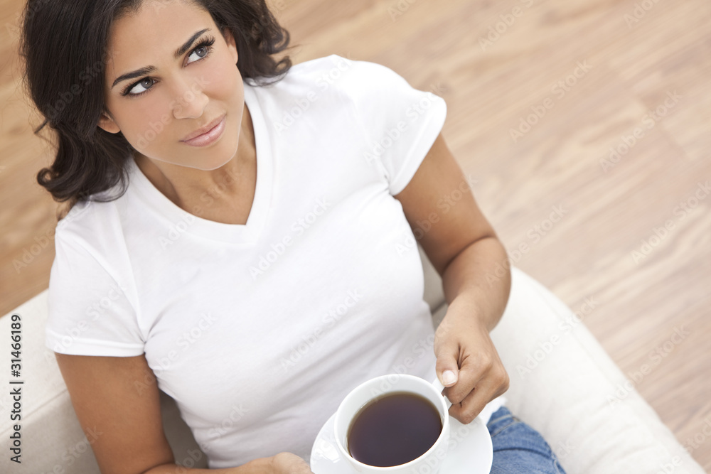 Beautiful Young Woman Drinking Tea or Coffee