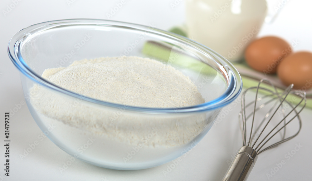 Sieved flour in glass bowl Sieved flour in glass bowl