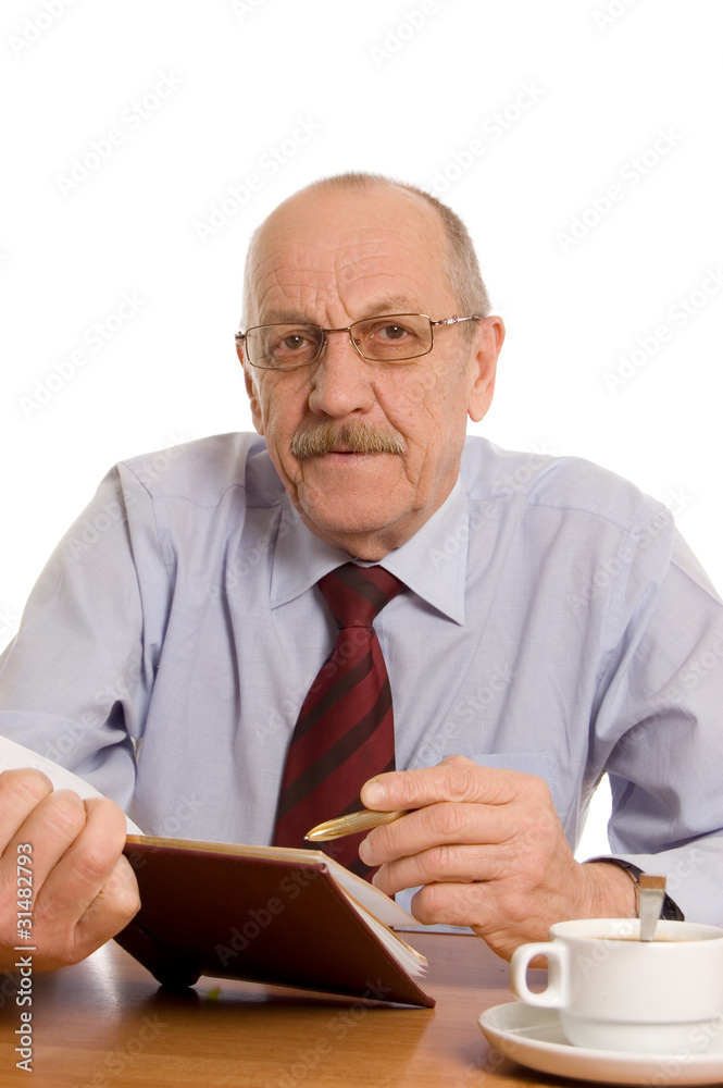 The businessman does records in a notebook The businessman does records in a notebook