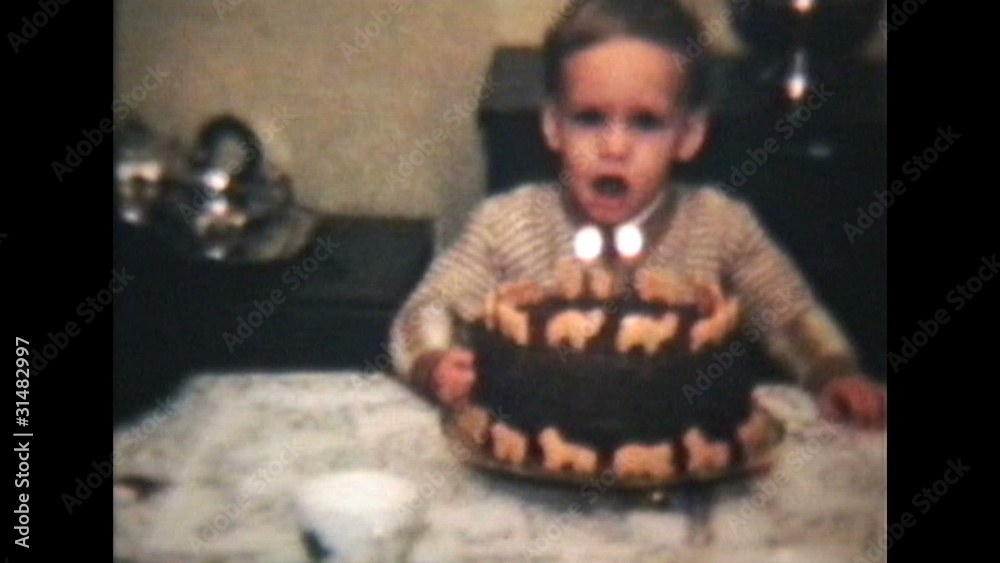 Little Boy Blows Out Candles On Cake (1964 Vintage 8mm film)