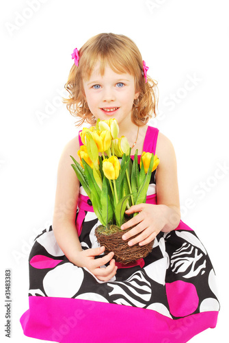 Little girl with spring flowers.