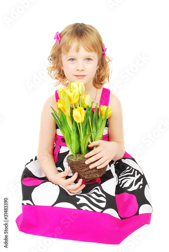 Little girl in fashion dresswith yellow flowers.