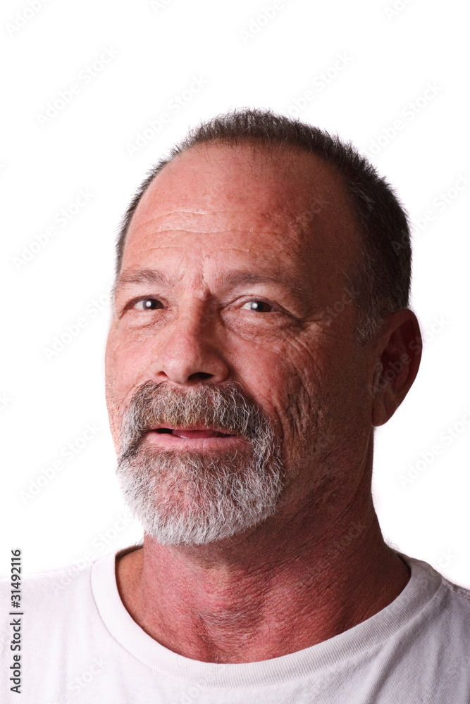 An older man with gray beard and mustache looking at camera An older man with gray beard and mustache looking at camera