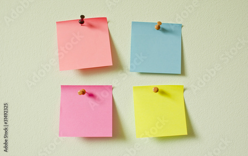Four color notes attached on the wall