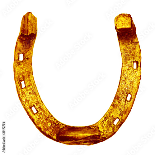Golden horseshoe on white background