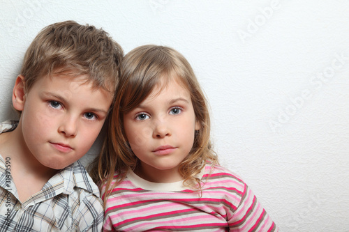 Portrait of thoughtful little girl and boy