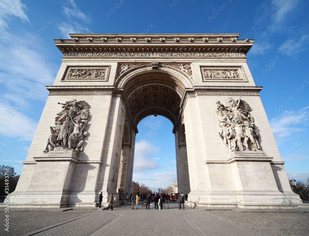 people near triumphal arch in Paris, France people near triumphal arch in Paris, France