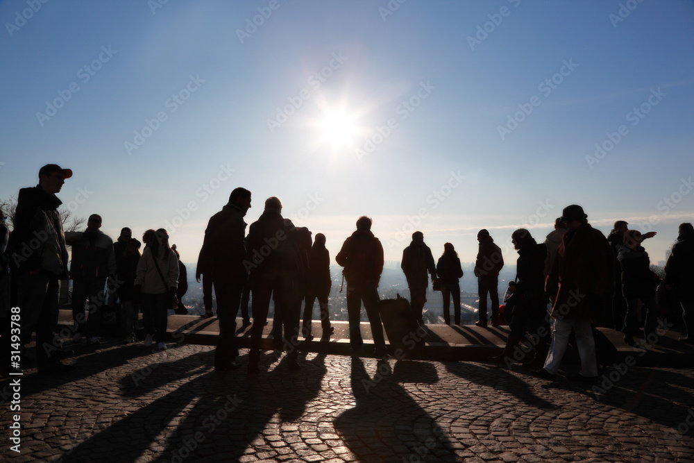 Tourists in Paris looking at panorama of city Tourists in Paris looking at panorama of city
