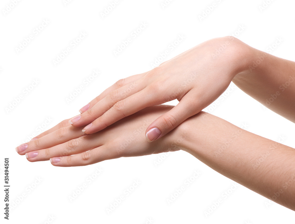 Beautiful female hands are isolated on a white background Beautiful female hands are isolated on a white background