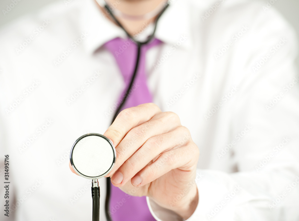 businessman checking with stethoscope businessman checking with stethoscope