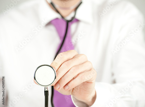 businessman checking with stethoscope