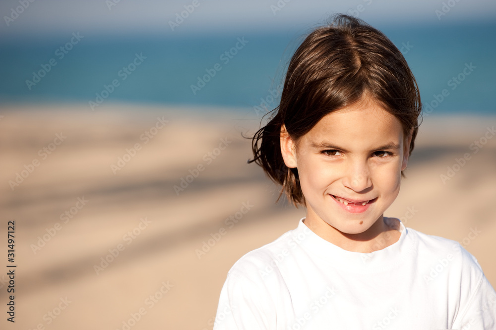 Little girl with the sea in the background Little girl with the sea in the background