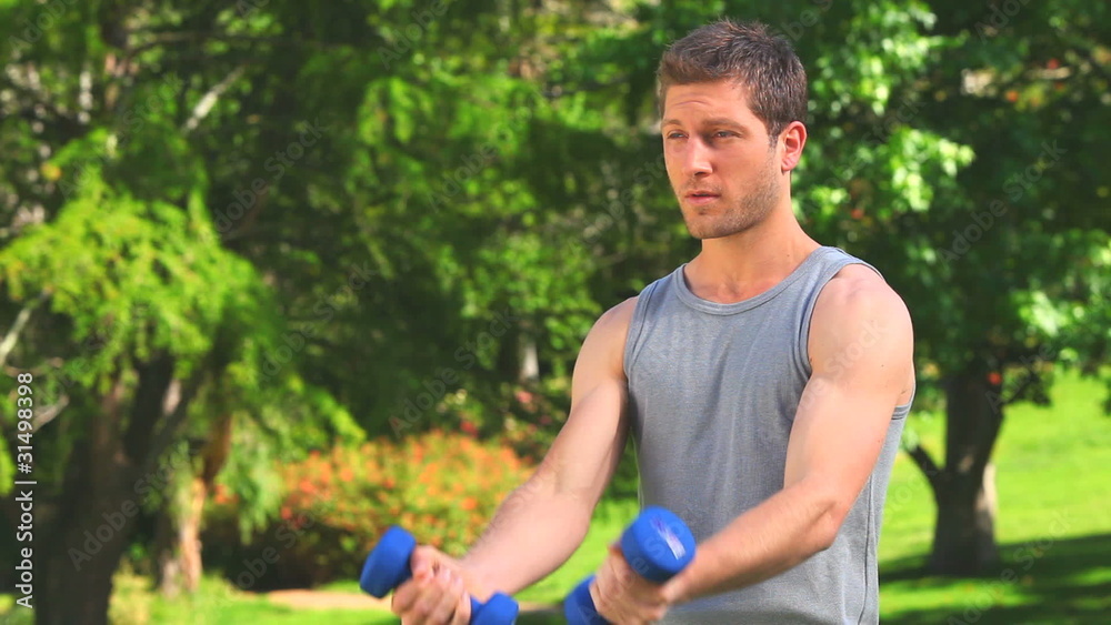 Handsome man doing musculation exercises Handsome man doing musculation exercises