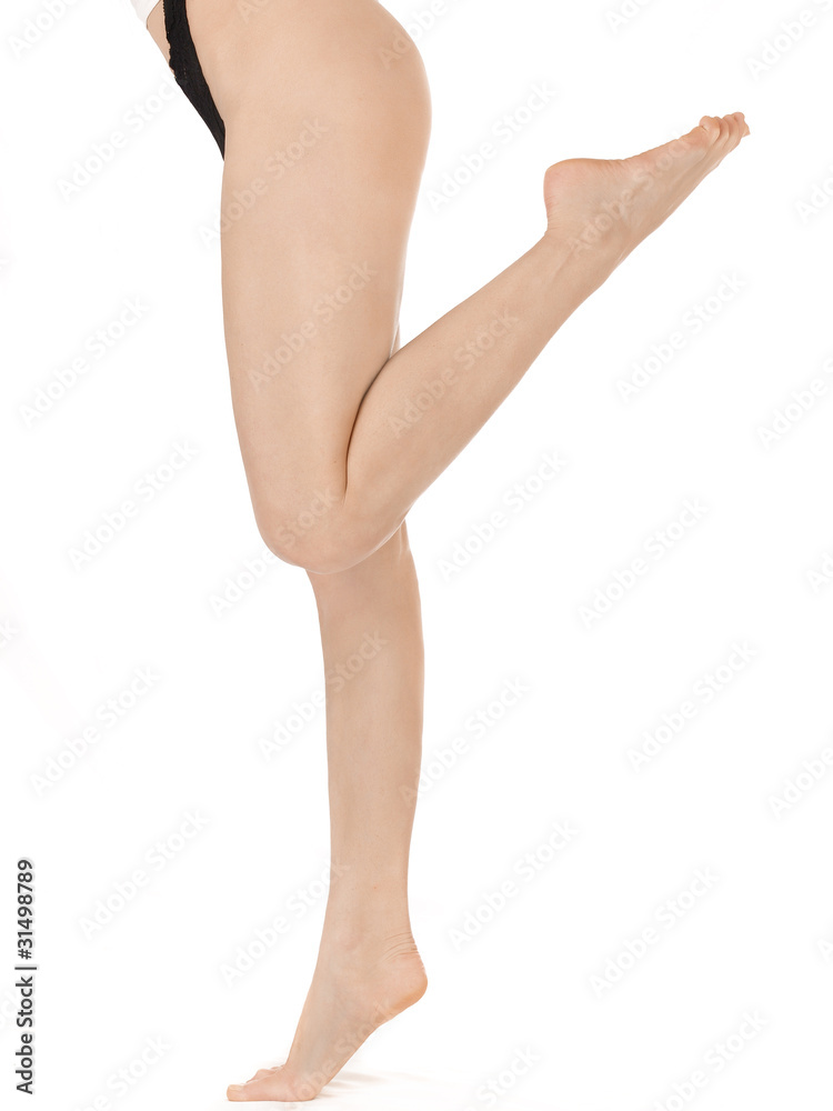 Slim woman's legs isolated on white Slim woman's legs isolated on white