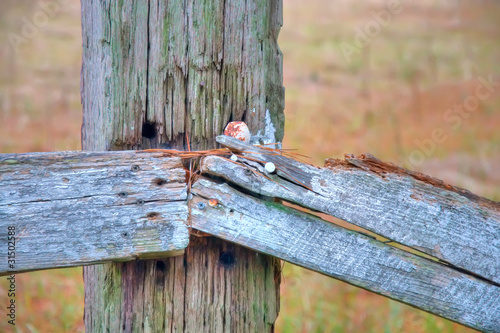Close Up of a Wooden Fence That Is Falling Apart