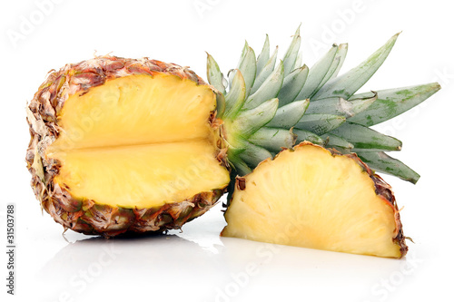Ripe pineapple fruit with slices isolated