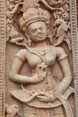 Sandstone carving at Prasat Sikhoraphum Sanctuary, Surin photo