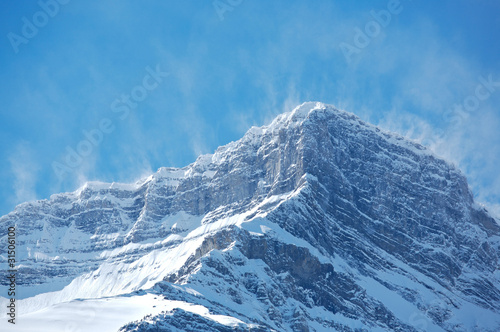 Snow spindrift on mountain peak 03