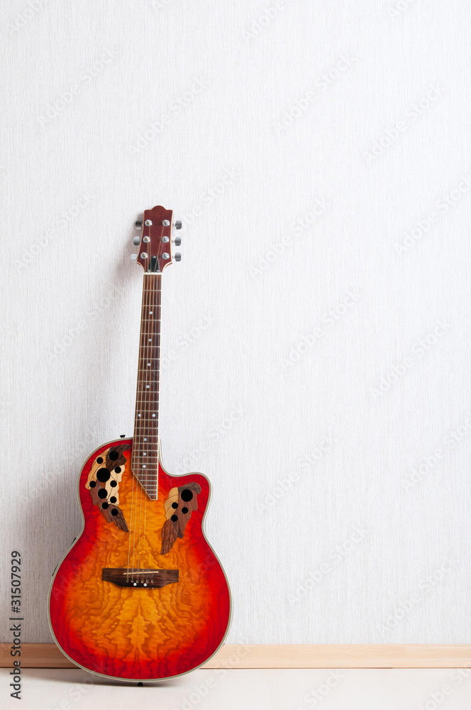 Fototapeta premium Musical concept with wooden guitar