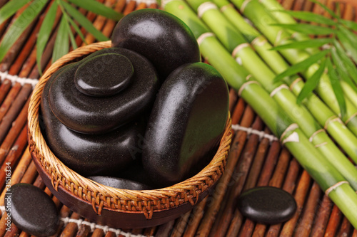 Photography Spa still life with hot stones and essential oil