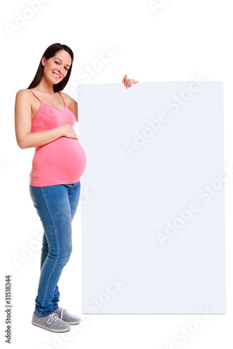 Pregnant woman holding blank sign.