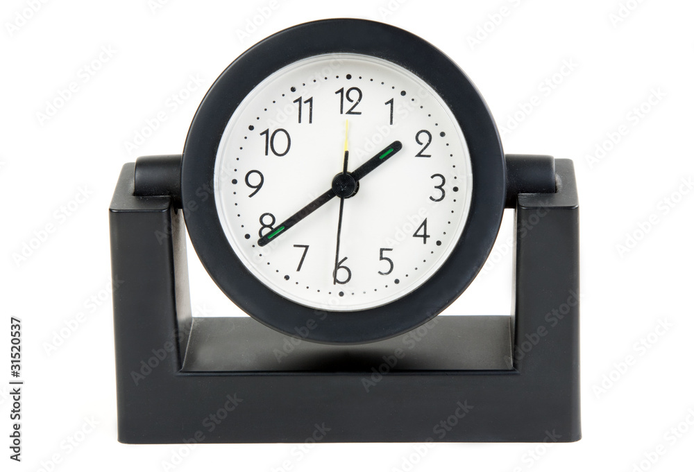 Desktops mechanical clock in a black plastic casing Desktops mechanical clock in a black plastic casing
