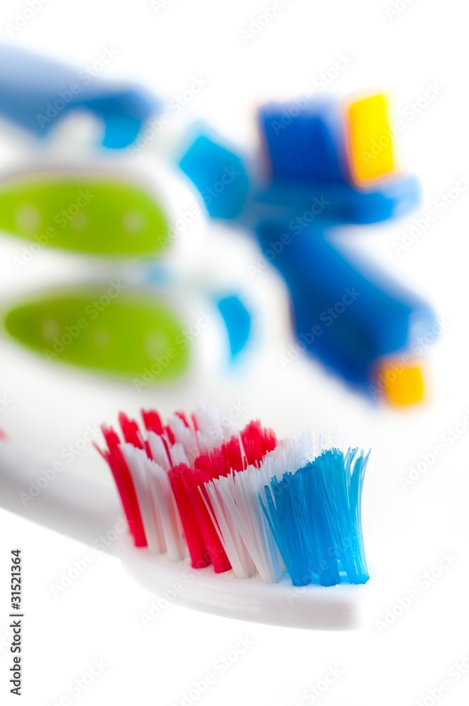 Close-up colorful toothbrush on a white background Close-up colorful toothbrush on a white background