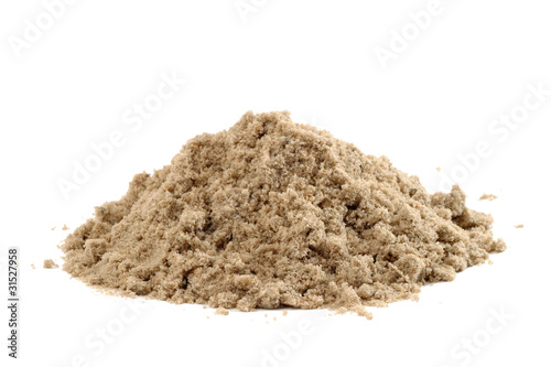 Handful of sand isolated on white background